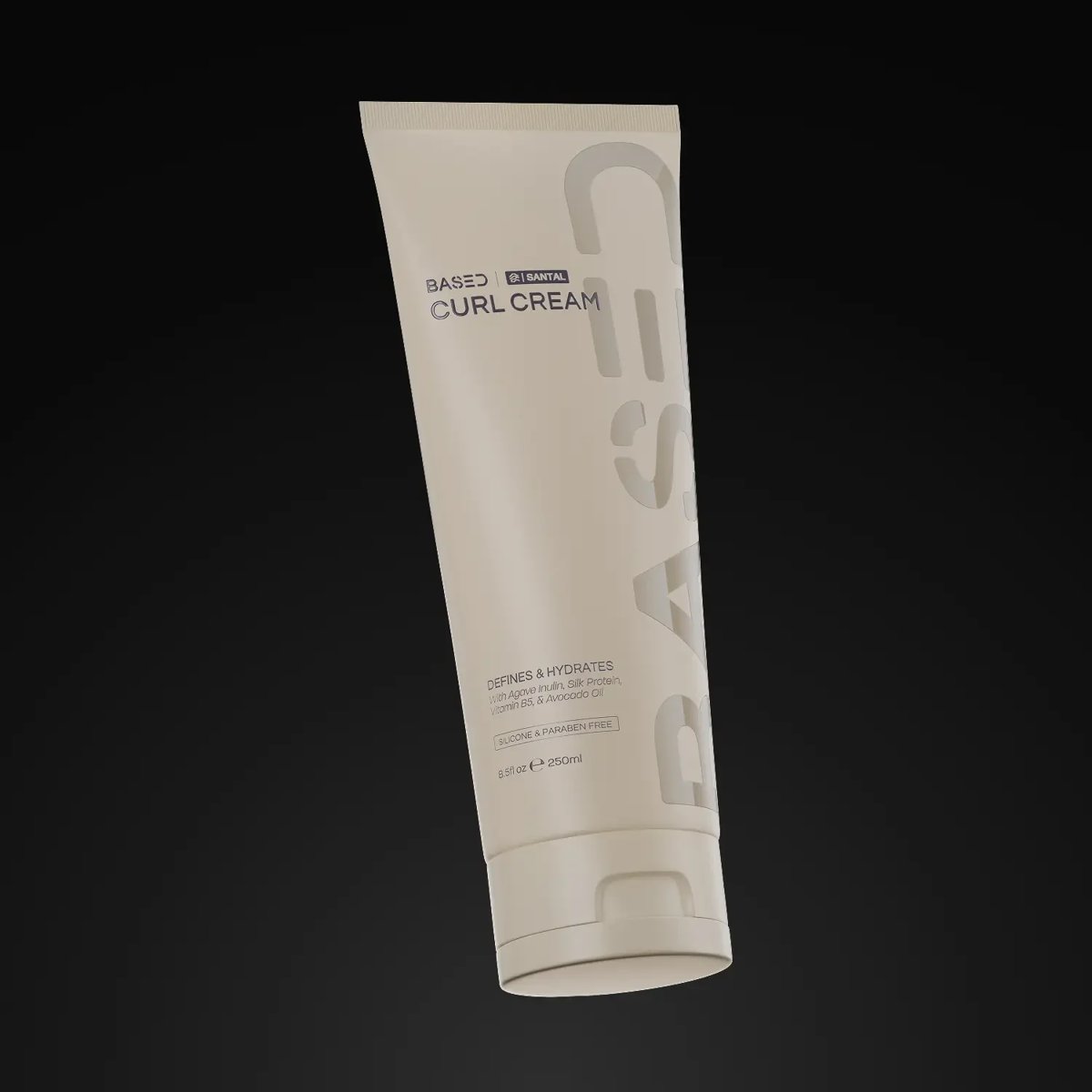 Tube of Based Bodyworks Curl Cream with grey label on dark background, angled view