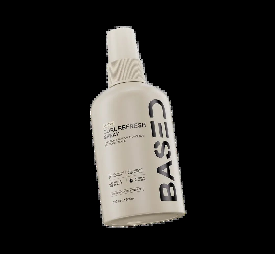 BASE Curl Refresh Spray bottle with white pump dispenser on black background