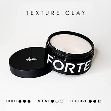 Black jar of Forte texture clay hair product with off-white cream inside, shown with open lid on light background